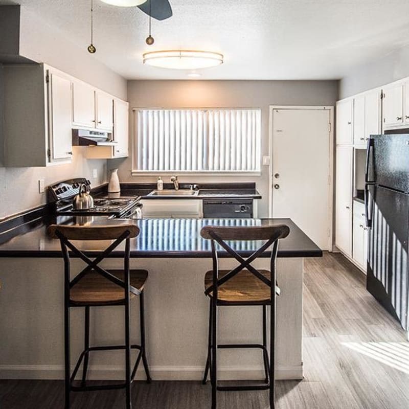 Kitchen with counter seating and lots of cabinet space at The Eleven Hundred in Sacramento, California