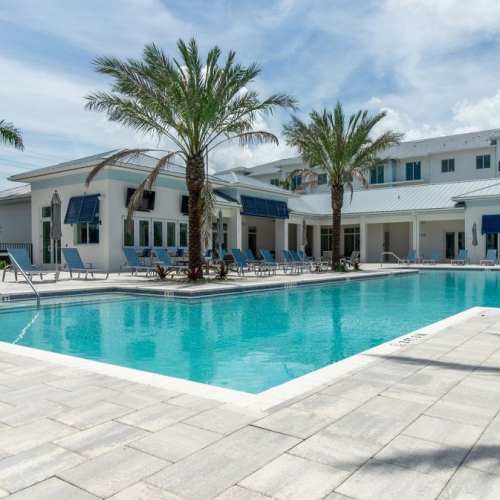 Lounge chairs by the swimming pool at River North in Stuart, Florida