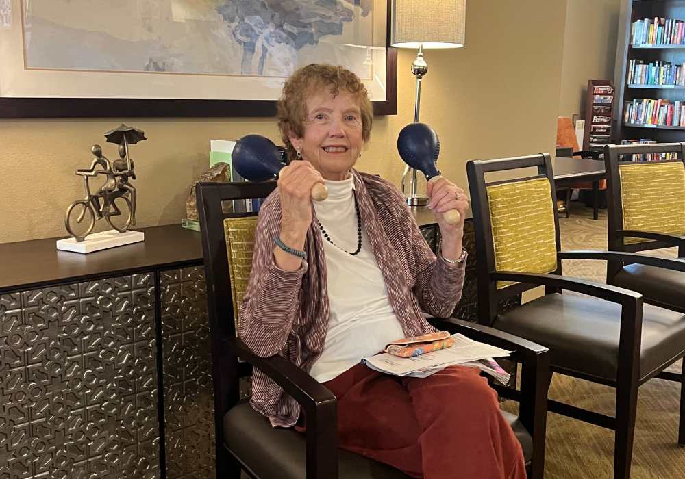 Resident with maracas at Merrill Gardens at Tacoma in Tacoma, Washington