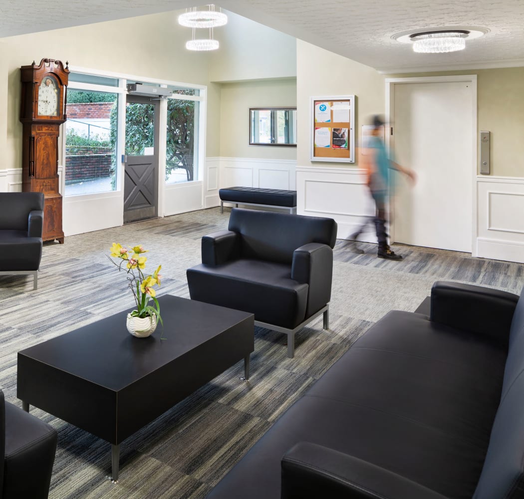 Community lounge near elevator at Fraser Tolmie Apartments in Victoria, British Columbia