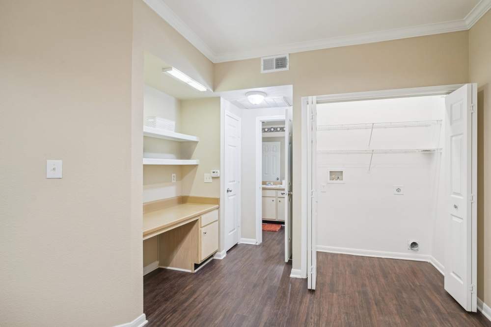 Master bedroom with access to closet and bathroom at Bristol Apartments in Houston, Texas