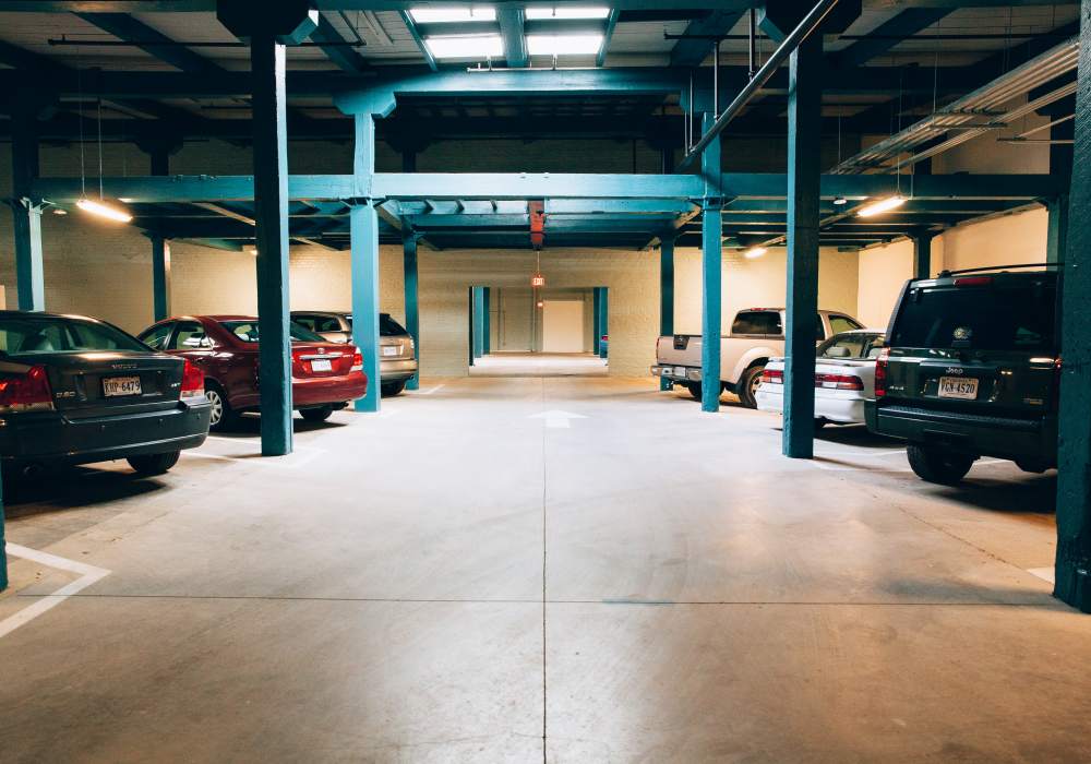Interior garage space with polished concrete floor and green accent wall at City View Lofts in Richmond, Virginia