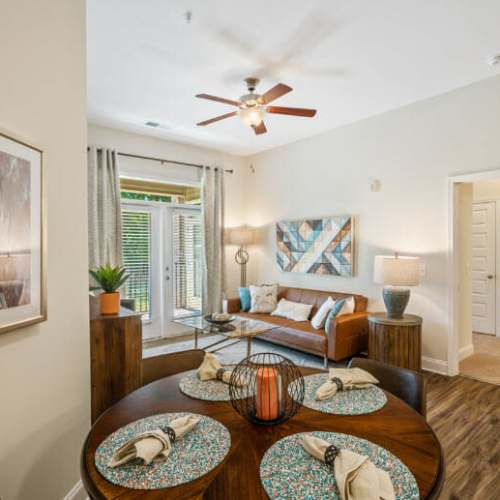Modern living room and access to dining area at Lodge at Lake Wylie in Lake Wylie, South Carolina