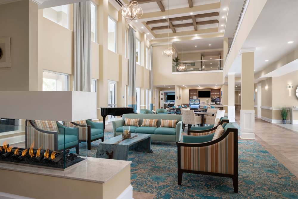 Club house with sitting area at The Pineapple House at Sapphire Lakes in Naples, Florida