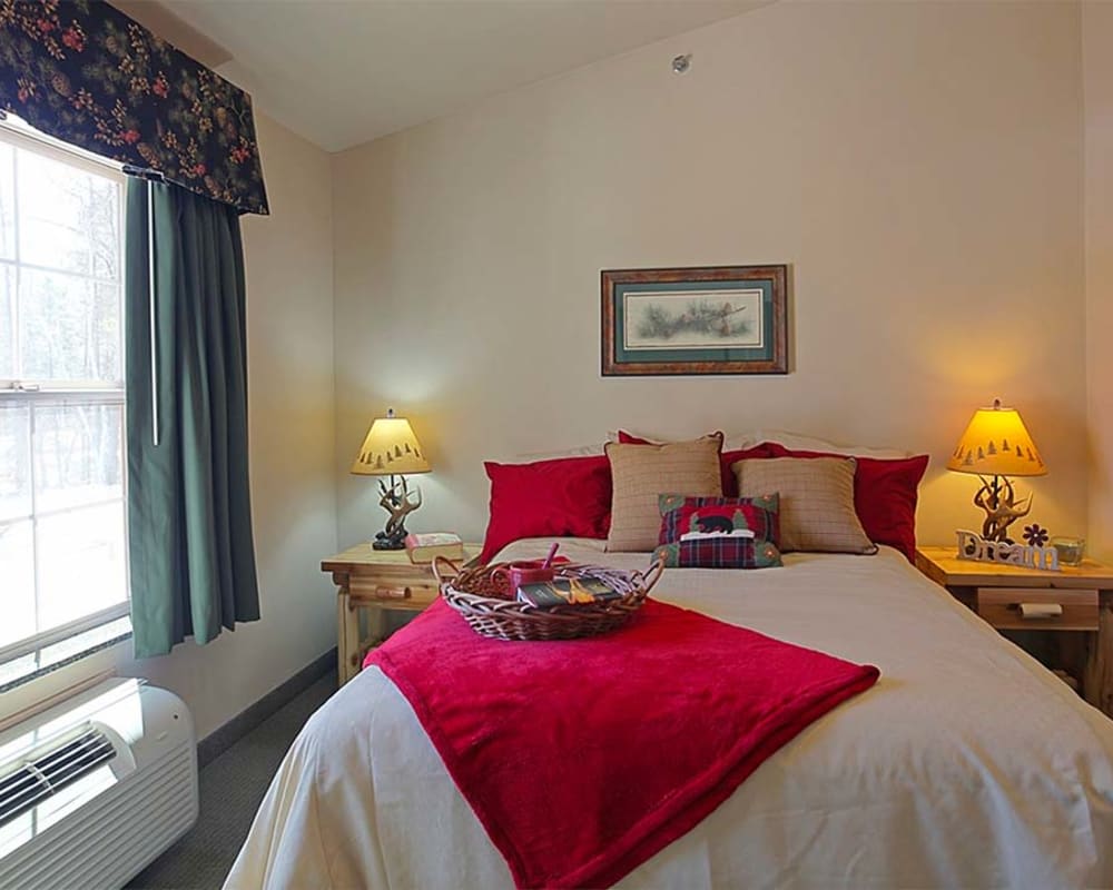 Cozy resident bedroom at Milestone Senior Living Eagle River in Eagle River, Wisconsin.