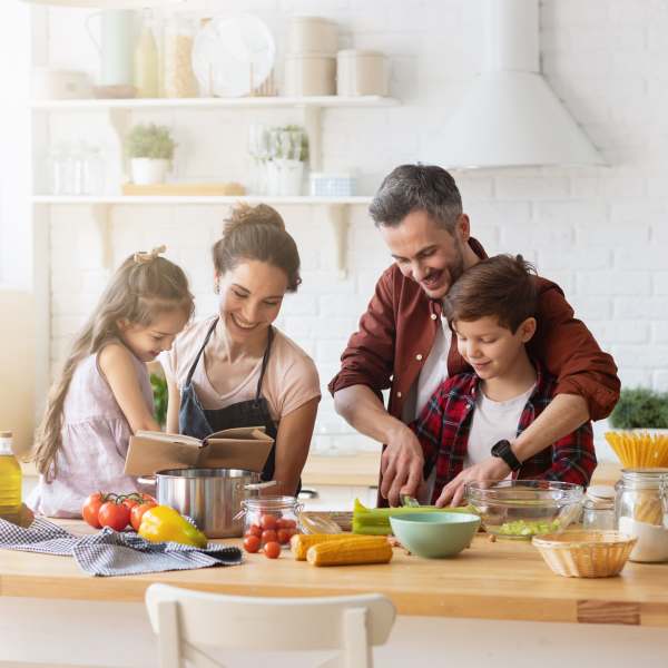 A family prepares a fresh meal in their kitchen at The Plaza Taos, Chandler, Arizona