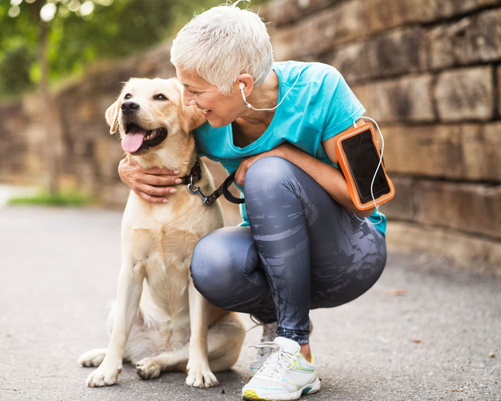 Resident out on a run with her dog at Live on 4th in Cincinnati, Ohio
