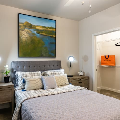 An apartment bedroom with a walk-in closet at Glenmoor Oaks in Moseley, Virginia