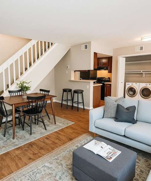 Living room with dining attached  at Stonehaven Apartments in Hazelwood, Missouri