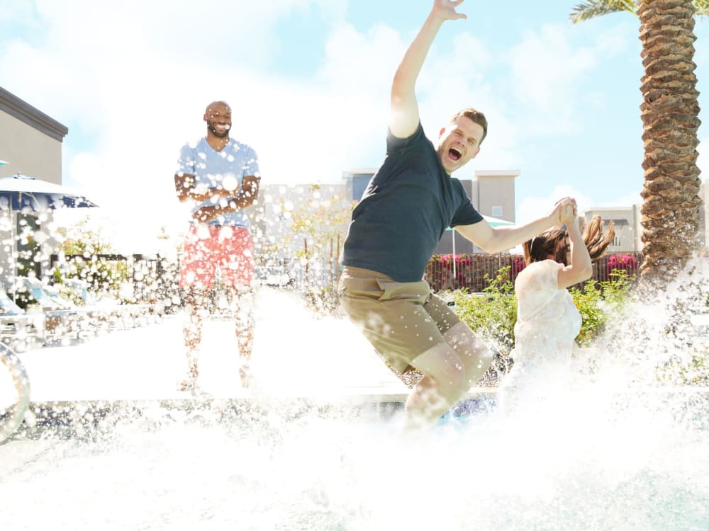 Residents enjoying the pool at BB Living Union Park in Phoenix, Arizona
