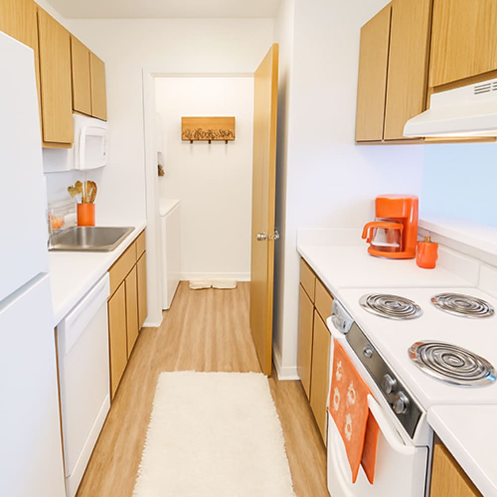 Kitchen with white appliances at Central Park Place in Grand Rapids, Michigan