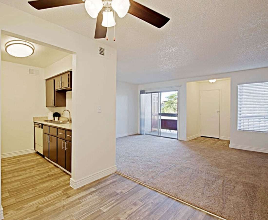 View of empty living room with access to kitchen at 544 Southern Apartments in Mesa, Arizona