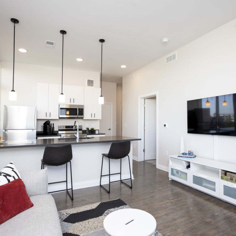 Open layout living room with kitchen view at The Sutton in , Ohio