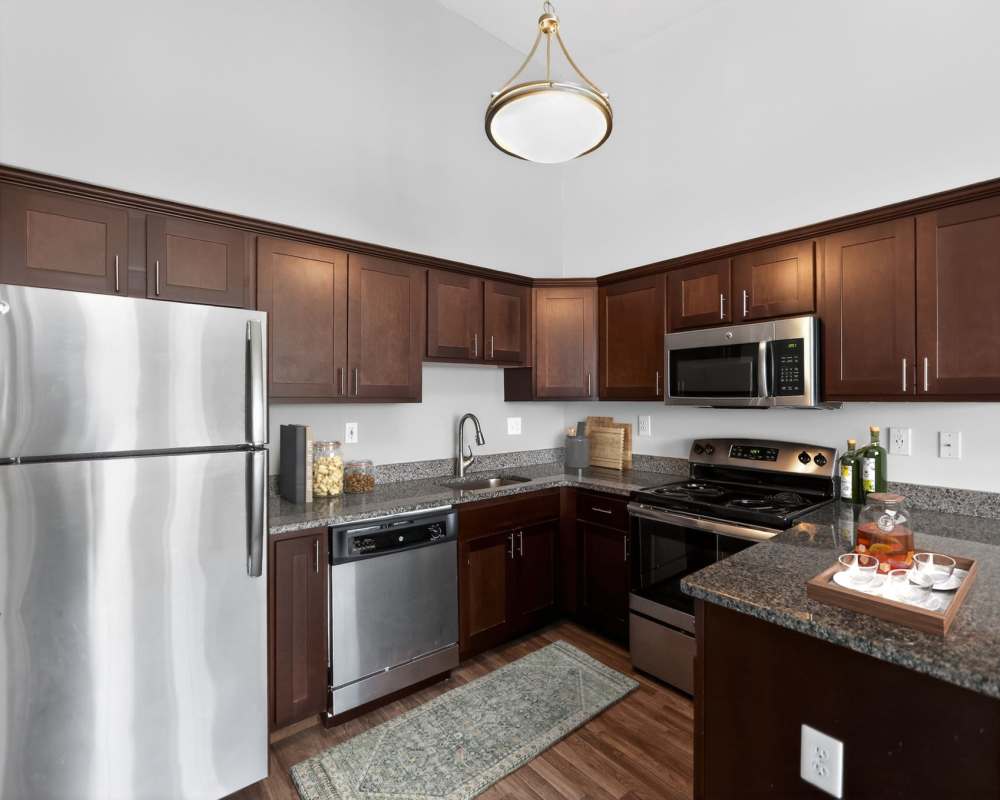 Kitchen with dishwasher at Mansions at Delmar, an Eagle Rock Community in Delmar, New York  