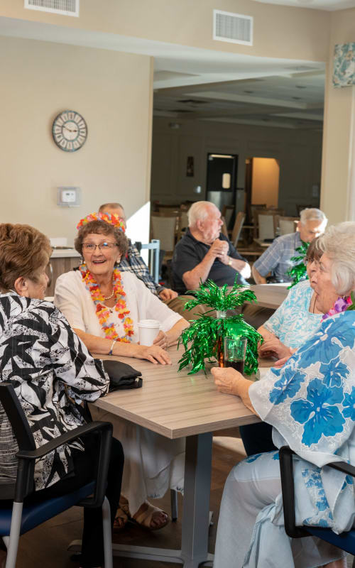 Group of residents at a luau event at The Views at Lake Havasu in Lake Havasu City, Arizona