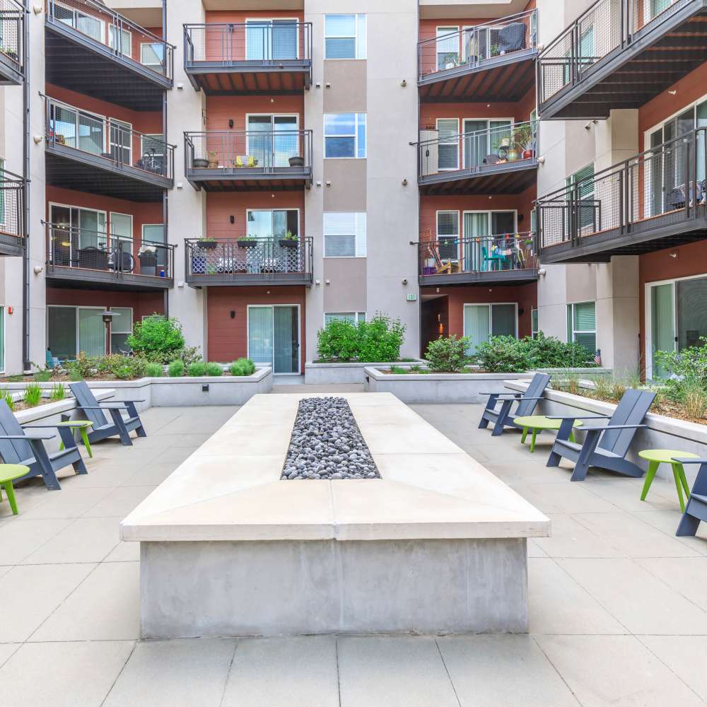 Outdoor firepit with lots of seating area at Park Place Olde Town Apartments in Arvada, Colorado
