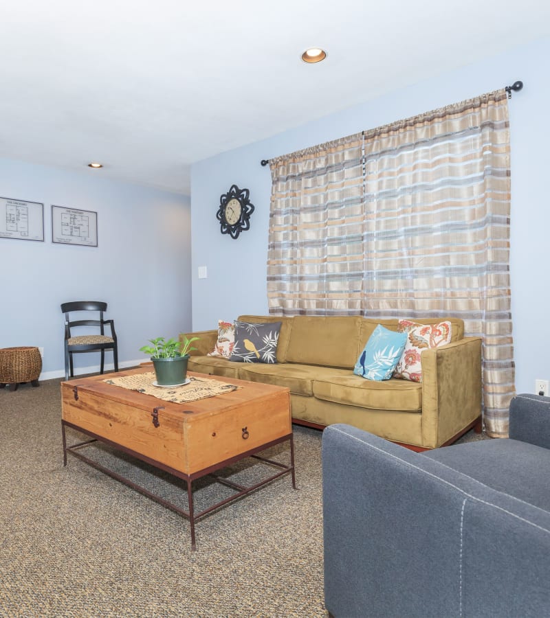 A furnished living room in a home at Magnolia Gardens in Brookhaven, Georgia