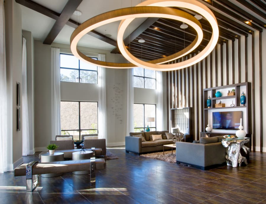 Modern and sleek resident lounge with a great view from the large windows at Reserve at the Ballpark in Atlanta, Georgia