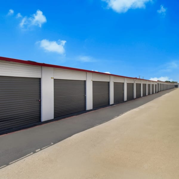 Drive up storage units with wide drive aisles at StorQuest Economy Self Storage in Mesquite, Texas
