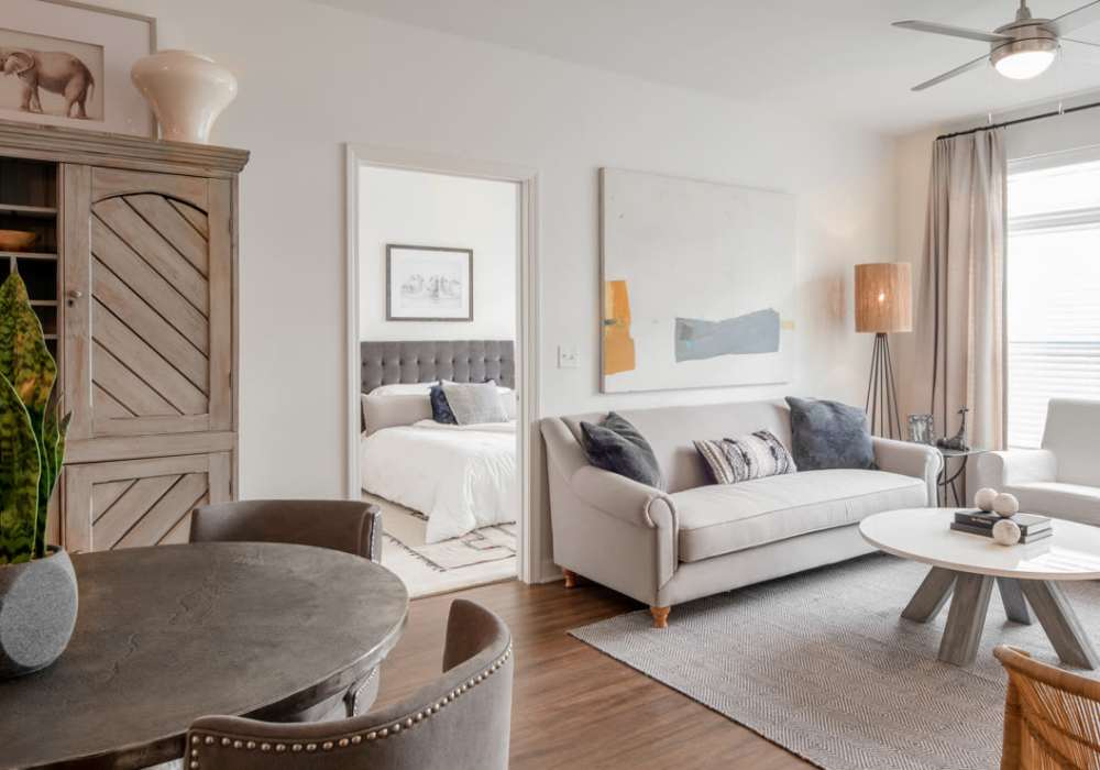 Stylish living room with neutral color palette at The Heron Downtown in Baton Rouge, Louisiana