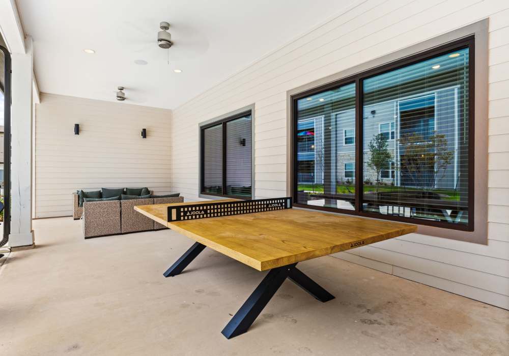 Covered patio with game table at Walnut Springs in Seguin, Texas