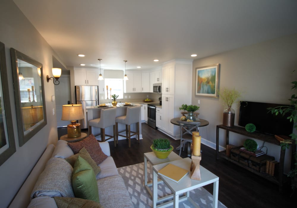 Spacious living room and kitchen with counter seating at Ramblewood Apartments in Fremont, California