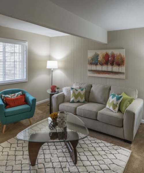 Living room with center table at Heather Ridge Apartments in Columbia, Missouri