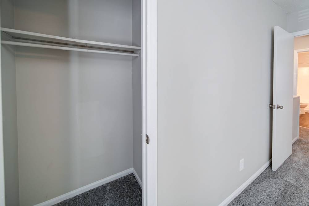 Unfurnished bedroom with closet access at The Manor Townhomes in Winston-Salem, North Carolina