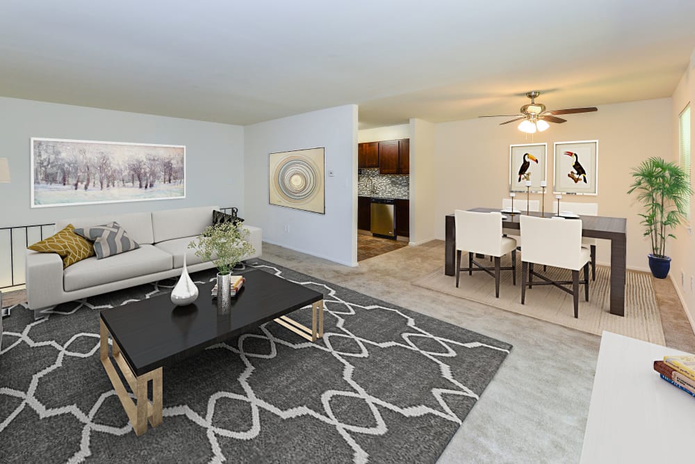 Open layout model living room and dining area at Mt. Arlington Gardens Apartment Homes in Mt. Arlington, New Jersey