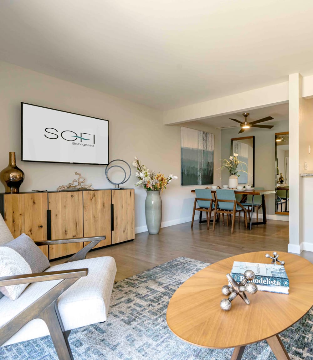 Well-decorated open-concept living space next to the dining area in a model home at Sofi Berryessa in San Jose, California