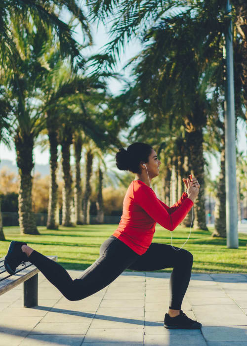 Resident exercising in park near Mission West Lofts in San Diego, California