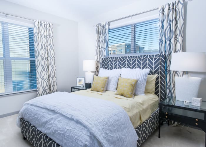 Beautiful bedroom with plenty of natural lighting at Palmer House Apartment Homes in New Albany, Ohio