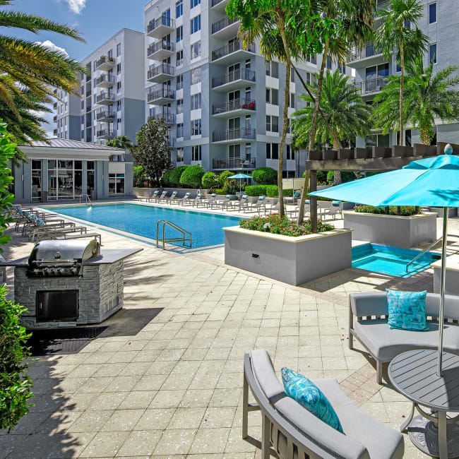 Beautiful hot tub underneath a wooden pergola at Midtown 24 in Plantation, Florida