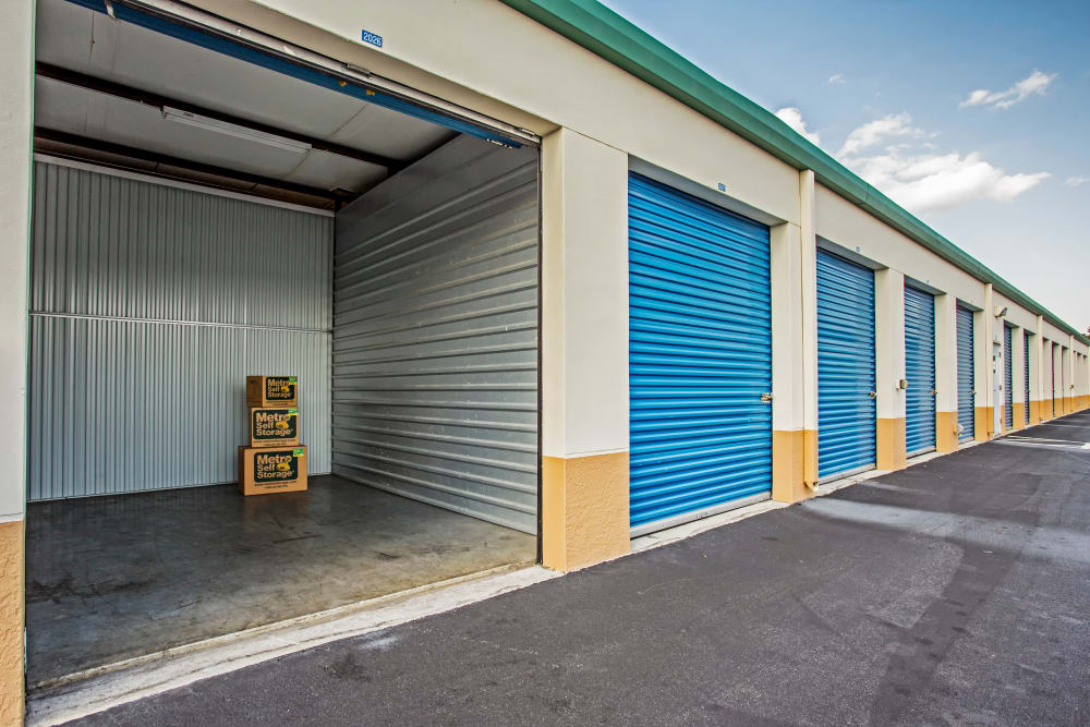 Open outdoor unit with packages at Metro Self Storage in Lehigh Acres, Florida