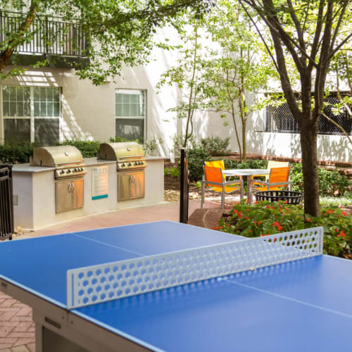 Outdoor ping pong table overlooking BBQ and dining area at Marq on Ponce in Atlanta, Georgia