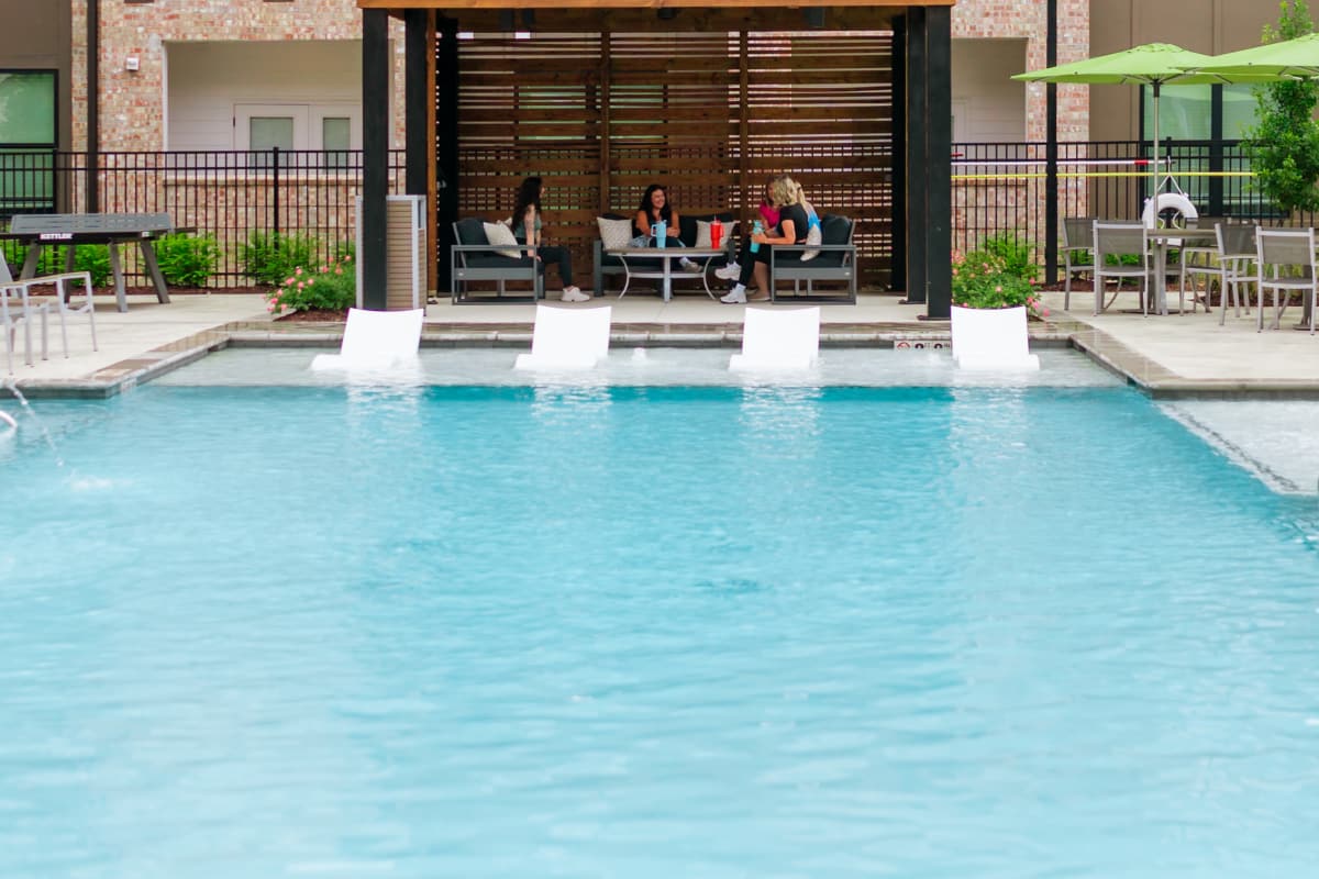 Swimming pool with lounger at The Heights at Waterpointe in Flowood, Mississippi
