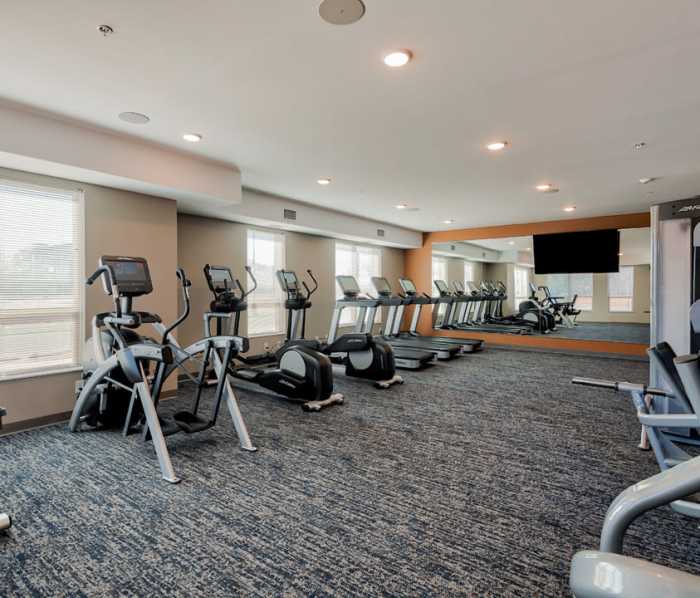 Fitness studio with treadmills and weight machines at LYRA in Coon Rapids, Minnesota