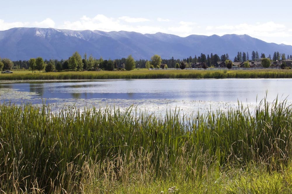 Lake and mountain backdrop at The Springs at Whitefish in Whitefish, Montana