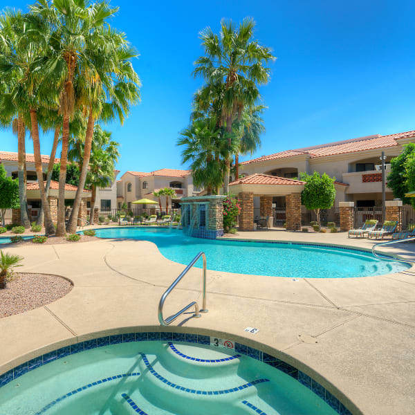 Luxurious resort-style swimming pool and hot tub at San Prado in Glendale, Arizona