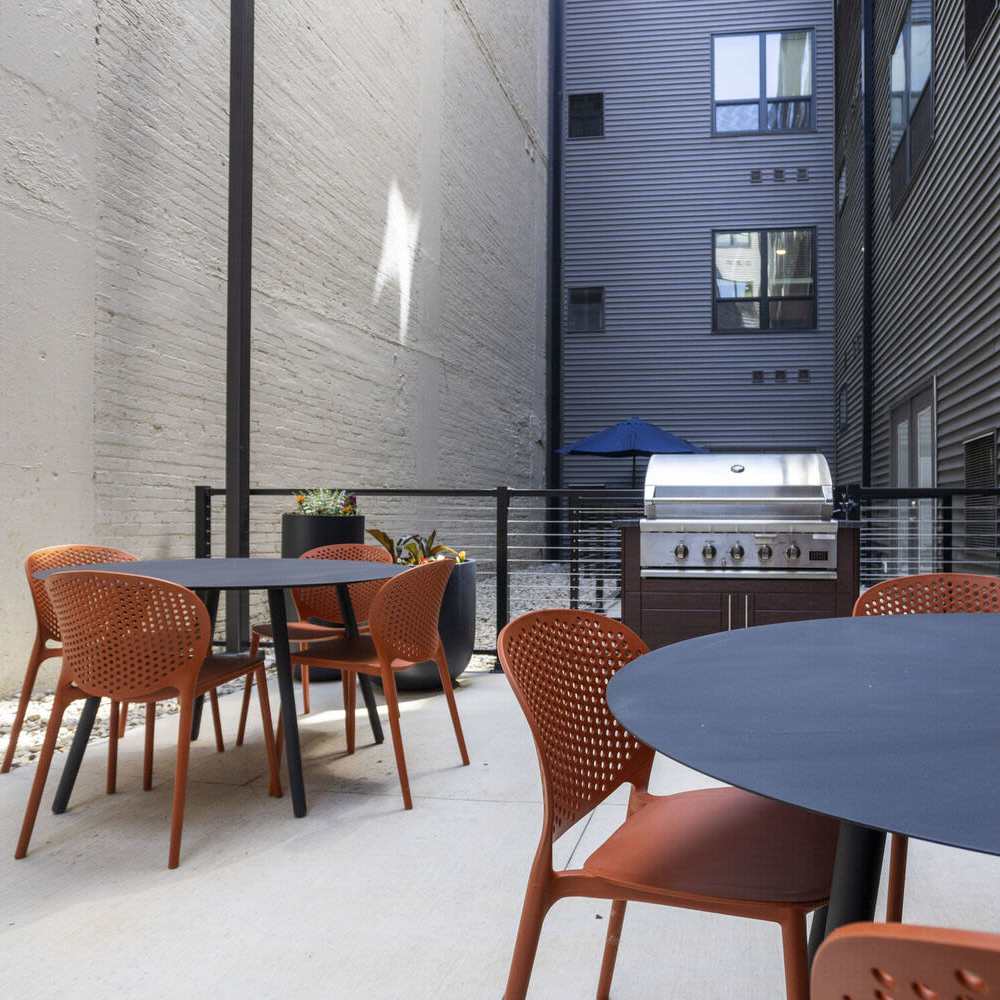 BBQ area with dining tables and chairs at The Sutton in , Ohio