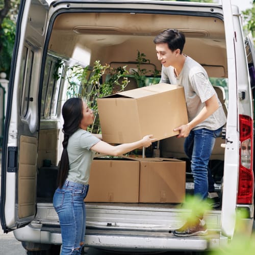 A couple loads a van with boxes to be stored at Red Dot Storage in Caledonia, Michigan