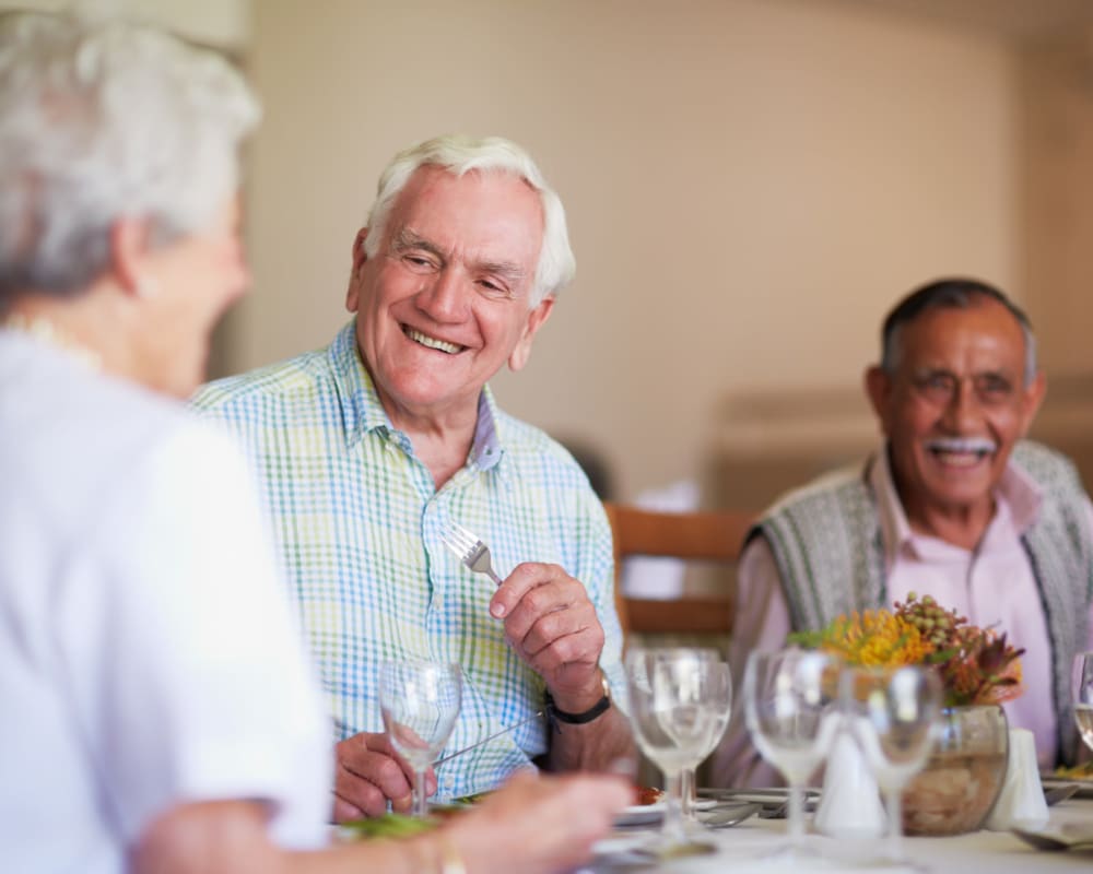 Residents enjoying a meal in the dining room at Milestone Senior Living Faribault in Faribault, Minnesota.