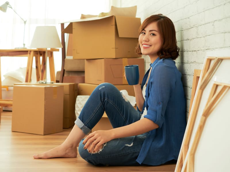A woman packing near 603 Storage - Lee in Lee, New Hampshire