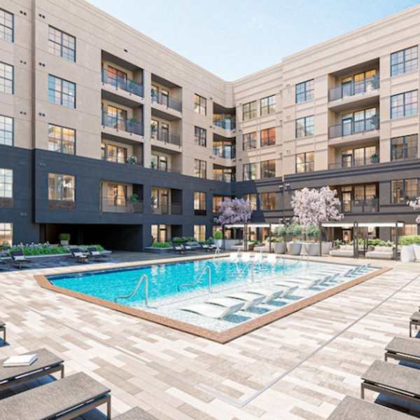 Resort style swimming pool with lounge chairs and surrounded by the apartment buildings at The Prospect in Charlotte, North Carolina