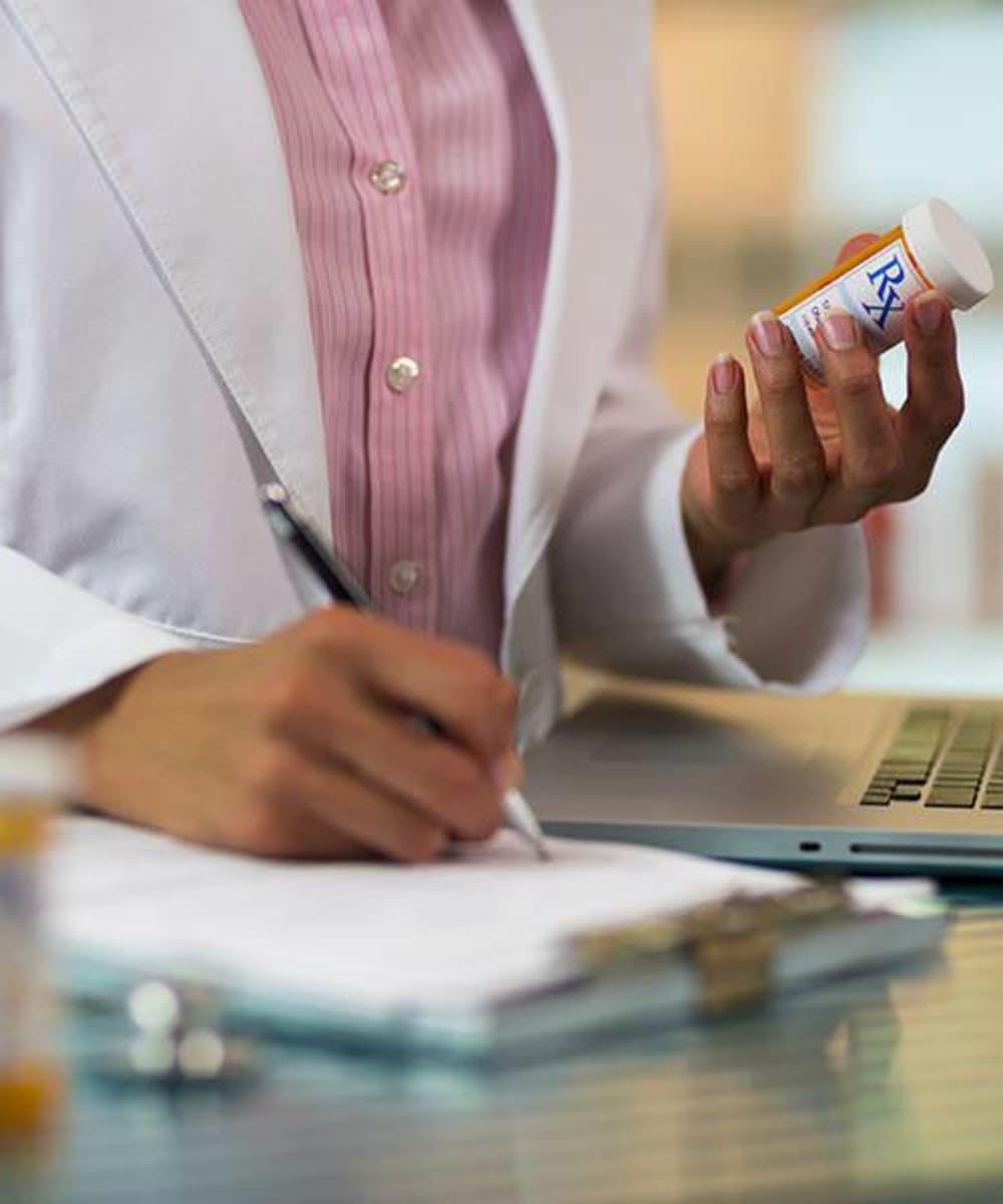 A nurse checking prescriptions at Brightwater Senior Living of Linden Ridge in Winnipeg, Manitoba