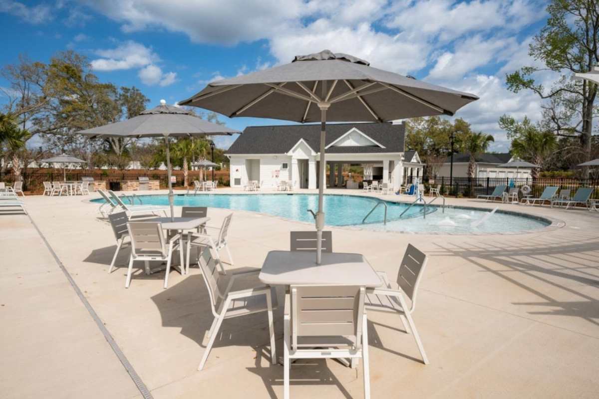 Swimming pool at Beaumont Oaks At Porters Neck Apartments & Townhomes in Wilmington, North Carolina