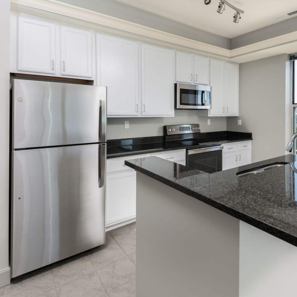 Kitchen with white appliances at Current at The Banks in Cincinnati,Ohio