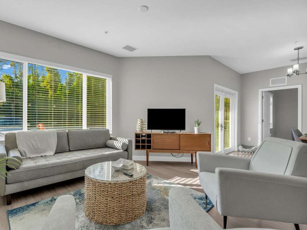Luxury living room with natural light at 81 West Apartments in Fort Myers, Florida