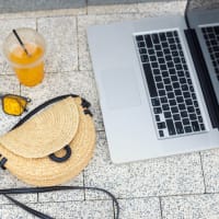 Computer with women's purse and drinking at Town Center Apartments in Lafayette, California