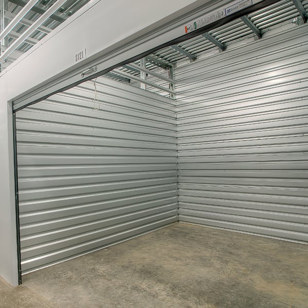 An open indoor storage unit at StorQuest Self Storage in North Miami Beach, Florida